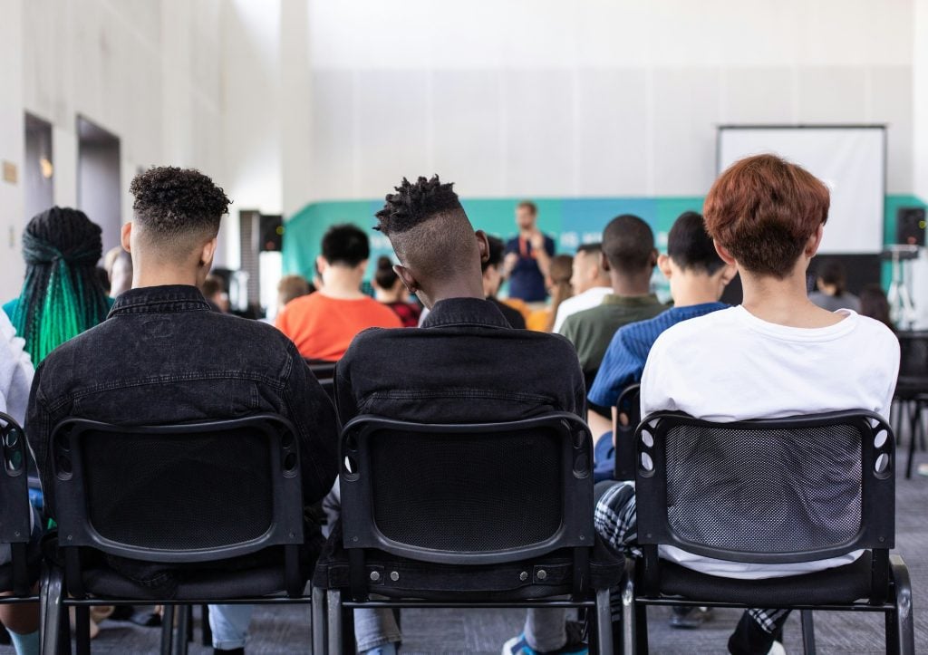 Students sitting class, view from back of class - Photo by Sam Balye on Unsplash